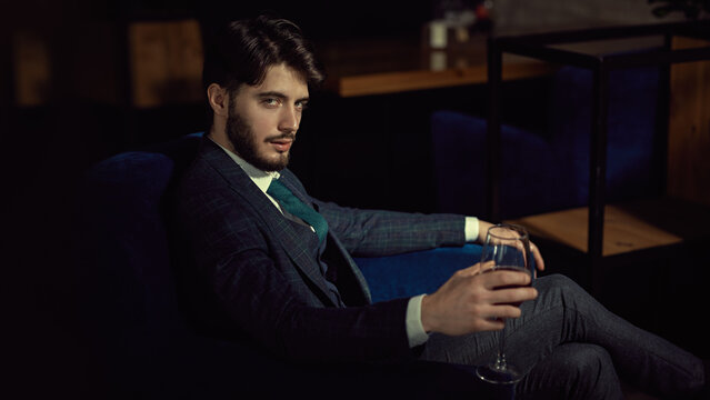 respectable man resting in armchair