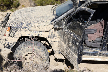 Off-road vehicle in muddy terrain.