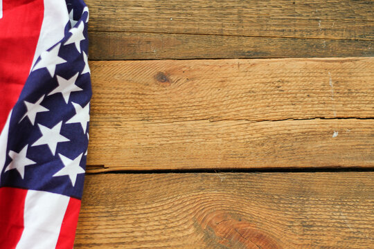 American flag Placed on a wooden background.