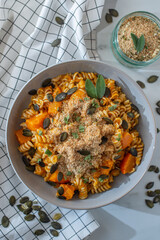 pasta alla zucca, healthy home made pumpkin pasta on a table