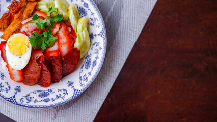 Rice with Red Roast Pork Served Boiled Egg and topped with Sweet Sauce.