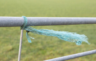 Small rope on a fence, windy day