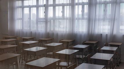 a empty classroom in the dark, natural light, school