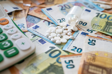 business calculator pharmacy pills and euro banknotes