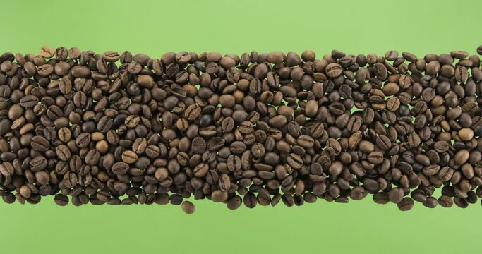 Line made from coffee beans top view. Slider shot. Isolated