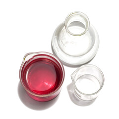 Chemicals ingredient on white laboratory table. Potassium Permanganate Liquid in beaker and Alcohol in Erlenmeyer flask.