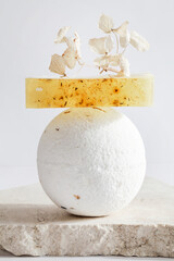 bath bomb and handmade soap with dry leaves on white background. Still life, relax, wellness concept. copy space. Skincare style. beauty items for spa