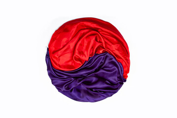 south Korean flag, yin and yang symbol made from red and purple satin on white background 