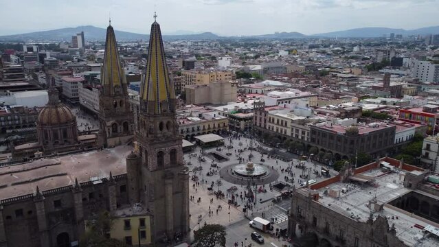 day flying counter clockwise around central plaza of Guadalajara Mexico