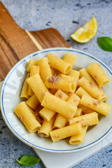  Italian home made  rigatoni   pasta  with  tuna  fish, parmesan cheese and black pepper .