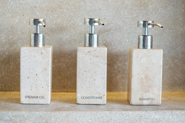 Toiletries bottles in bathroom at luxury hotel or modern home. shower container set, body shower...