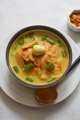 a bowl of bamboo shot cooked in curry or opor rebung in Bahasa 