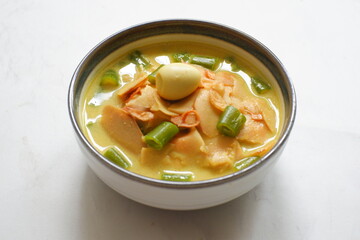 a bowl of bamboo shot cooked in curry or opor rebung in Bahasa 