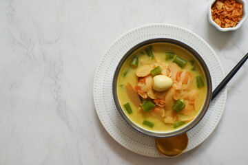 a bowl of bamboo shot cooked in curry or opor rebung in Bahasa 