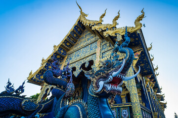 Chiang Rai, Thailand - January, 09, 2022 :  Thai traditional church is the art of Wat Rong Suea Ten at Chiangrai Thailand.