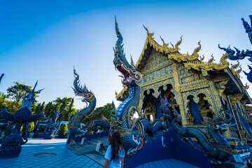 Fototapeta premium Chiang Rai, Thailand - January, 09, 2022 : Thai traditional church is the art of Wat Rong Suea Ten at Chiangrai Thailand.