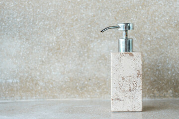 Fototapeta na wymiar Toiletries bottles in bathroom at luxury hotel or modern home. body shower gel in ceramic ware with wall background