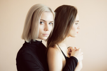 Top view of two young women on a light background.