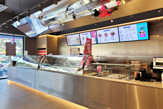 PENANG, MALAYSIA - 12 FEB 2022: Interior view of Baskin-Robbins store in Penang. It is the world's largest chain of ice cream specialty shop restaurants.