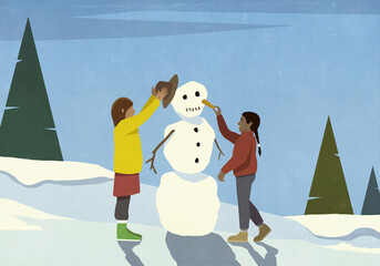 Girls making snowman, adding hat and carrot nose in snowy field
