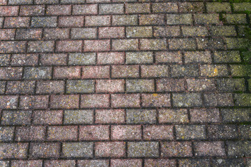 Stone pavement with abstract pattern closeup. crumble with age. construction, repair. concept of destruction, decline. High quality photo