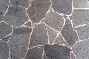 Stone pavement with abstract pattern closeup. crumble with age. construction, repair. concept of destruction, decline. High quality photo