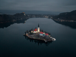 Slovenian Castle Bled in the early morning - aerial shot drone flight (DJI Mavic 3)  Cold Winter Landscape