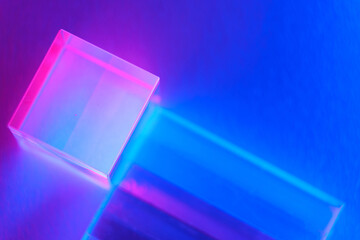 Neon background with geometric shapes. Luminous glass objects with multi-colored lighting, soft...
