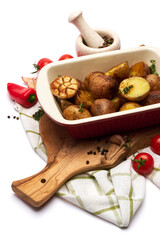 Baked potato in baking dish pot isolated on white background