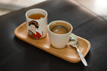 hot coffee cup with teacup