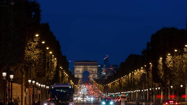 Champs-Elysees Avenue in Paris at Night With La Defense Business District in Background