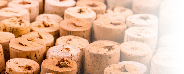 Background pattern of wine bottles corks in soft diffused light. Selective focus