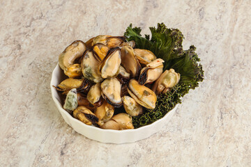 Tasty marinated mussels in the bowl