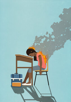 Exhausted schoolgirl on fire, sleeping at classroom desk
