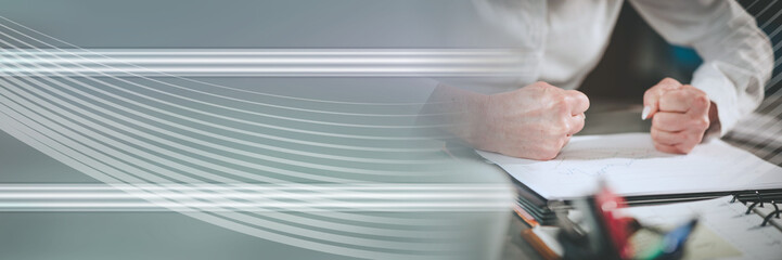 Angry businesswoman at her workplace; panoramic banner