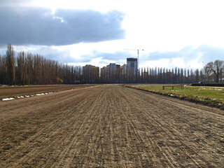 Hippodrome. The empty track of the hippodrome, trampled by hooves. Spring and new racing season. Running track for horses. Stadium or running track in a big city