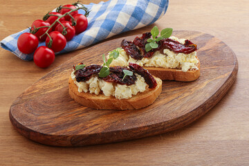 Bruschetta with soft cheese and tomato