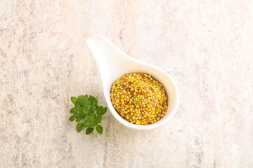 Grain mustard sauce in the bowl