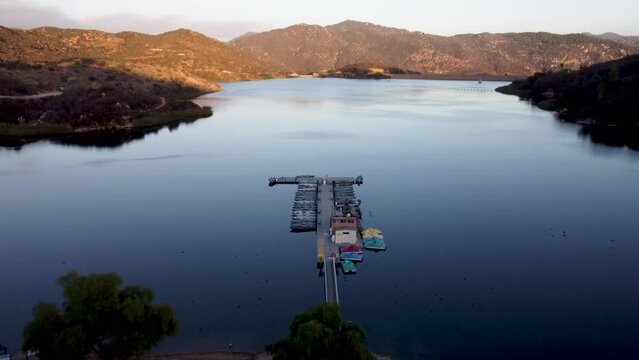 A beautiful aerial shot flying over a marina in Dixon Lake with crystal clear water in Escondido, California