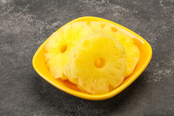 Sweet pineapple rings in the bowl