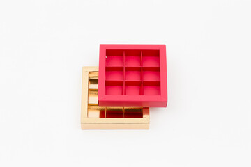red and gold candy boxes on a white background top view
