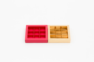 red and gold candy boxes on a white background top view