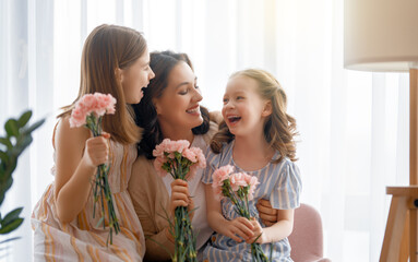 daughters are congratulating mother