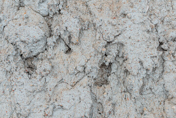 Cracked concrete wall gray cement surface background.cracked grey stone wall in winter.close-up.