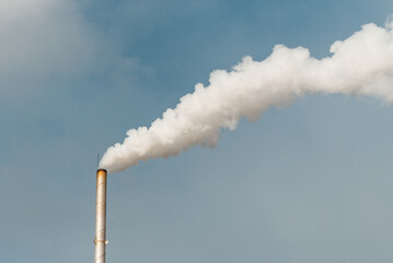 Pipe and smoke.Polluting air with white smoke from industrial chimney outdoors. CO2 emissions.Copy...