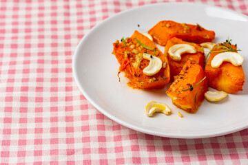 Fried baked pumpkin with spices, olive oil, herbs.