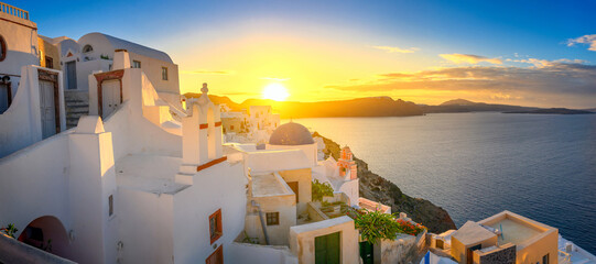Fototapeta na wymiar Picturesque sunrise on famous view resort over Oia town on Santorini island, Greece, Europe. famous travel landscape. Summer holidays. Travel concept background.
