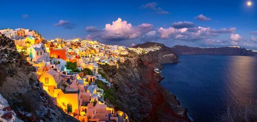 Fantastic Sunset night view of traditional Greek village Fira on Santorini island, Greece, Europe....