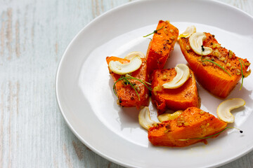 Fried baked pumpkin with spices, olive oil, herbs.
