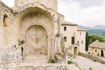 Arch of a castle ruin on the top of the old village Le-Po&euml;t-Laval in the south of France in the Dr&ocirc;me